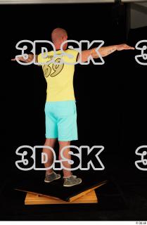Whole body yellow shirt turquoise shorts brown shoes modeling t…